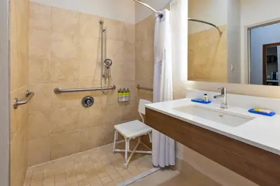 a bathroom with a sink and a shower at Holiday Inn Express & Suites Dayton South Franklin by IHG in Franklin