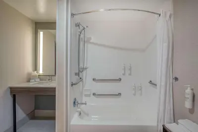 a bathroom with a shower and a sink at Hilton Garden Inn Clarksburg in Clarksburg