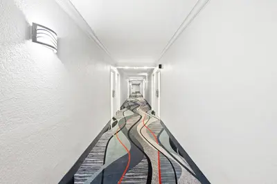 a hallway with a painting on the wall at Quality Inn Dayton Airport in Englewood