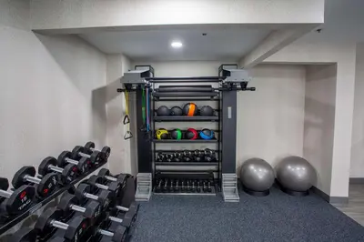 a room with a gym with a bunch of equipment at Hampton Inn Springfield in Springfield