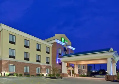 a hotel with a sign on the side of a building at Holiday Inn Express Hotel & Suites Tipp City by IHG in Tipp City