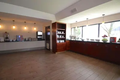 a large room with a kitchen and a counter at Country Inn & Suites by Radisson, Sandusky South, OH in Milan