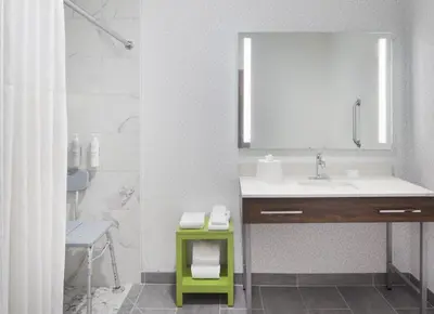 a bathroom with a sink and a mirror at Hampton Inn Youngstown/Boardman in Poland