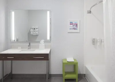 a bathroom with a sink and a mirror at Hampton Inn Youngstown/Boardman in Poland