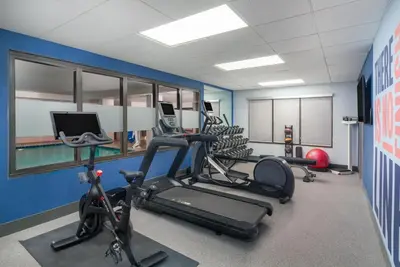a gym with several exercise bikes in a room at Hampton Inn Marietta in Marietta