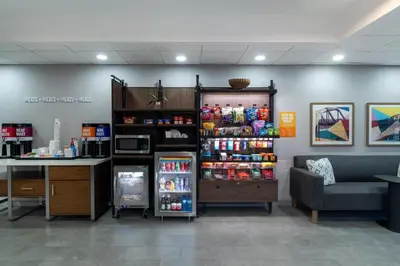 a store with a refrigerator and a table and a couch at Hampton Inn Marietta in Marietta