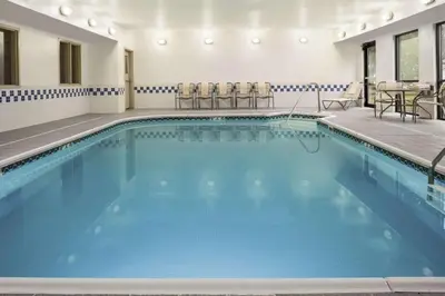a large pool with blue water in a hotel room at Hampton Inn Zanesville in Zanesville