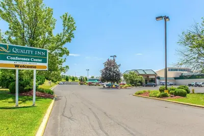 a street sign in front of a car dealership at Quality Inn and Conference Center in Springfield