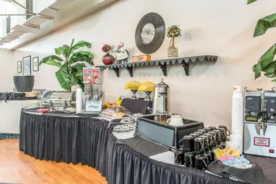a table with a black table cloth in a room at Quality Inn and Conference Center in Springfield