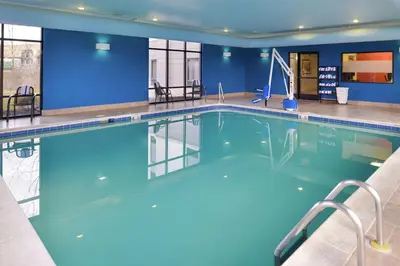 a large pool with blue water in a hotel room at Hampton Inn & Suites Wilmington in Wilmington