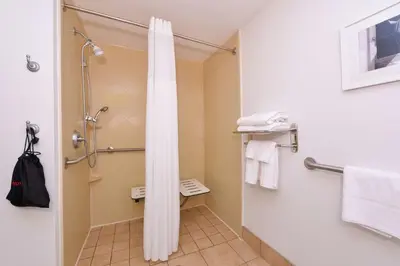a bathroom with a shower with a shower curtain at Hampton Inn & Suites Wilmington in Wilmington