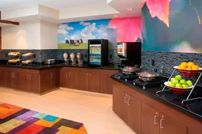 a kitchen with a counter with fruit on it at Fairfield Inn & Suites by Marriott Dayton South in Centerville