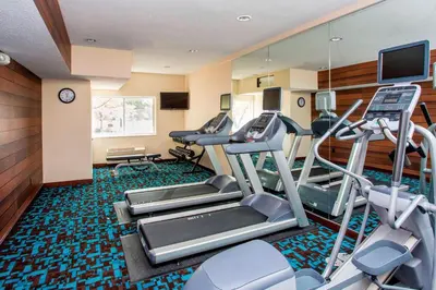 a gym with cardio equipment in a hotel room at Fairfield Inn & Suites by Marriott Dayton South in Centerville