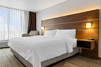 a hotel room with a large bed and a window at Holiday Inn Express Hotel & Suites Marion by IHG in Marion