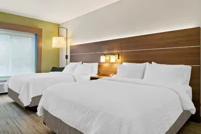 a hotel room with two beds and a window at Holiday Inn Express Hotel & Suites Marion by IHG in Marion