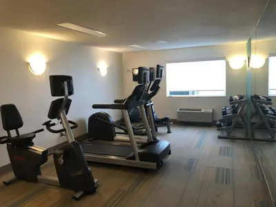 a gym with cardio equipment in a room at Holiday Inn Express Mt. Vernon by IHG in Mount Vernon