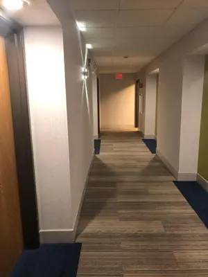 a hallway of an office building with a long corridor at Holiday Inn Express Mt. Vernon by IHG in Mount Vernon
