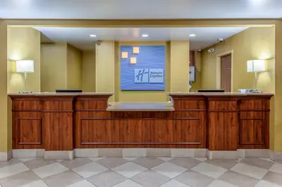 a waiting room with a sign on the wall at Holiday Inn Express Hotel & Suites Bowling Green by IHG in Bowling Green