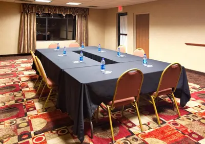 a long table in a room with chairs around it at Holiday Inn Express Hotel & Suites Bowling Green by IHG in Bowling Green
