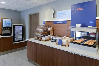 a bakery counter with donuts on display in a store at Holiday Inn Express Hotel and Suites Marysville by IHG in Marysville
