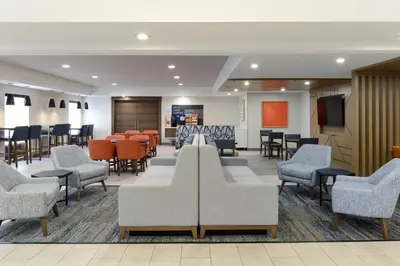 a waiting room at a hospital with chairs and tables at Holiday Inn Express Hotel and Suites Marysville by IHG in Marysville
