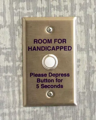 a sign on a shirt that says room for handicapped at Embassy Suites Columbus - Airport in Columbus