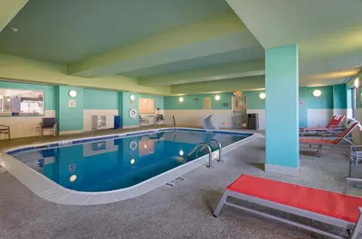 a large swimming pool in a large room at Holiday Inn Express Hotel & Suites Weston by IHG in Weston