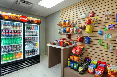 a soda machine in a store with a lot of drinks at Holiday Inn Express Hotel & Suites Weston by IHG in Weston