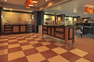 a large room with a checkerboard floor and a barber shop at Hampton Inn Defiance in Defiance