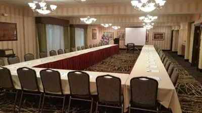 a large conference room with a long table and chairs at Holiday Inn Express Hotel & Suites Youngstown North-Warren/Niles by IHG in Warren