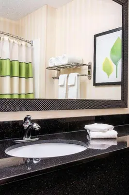 a bathroom with a sink and a mirror at Fairfield Inn Middletown Monroe in Middletown