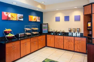 a restaurant with a counter with food on it at Fairfield Inn Middletown Monroe in Middletown