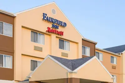 a hotel building with a sign on it at Fairfield Inn & Suites Ashland in Ashland