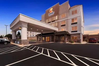 a hotel with a parking lot in front of it at Comfort Inn & Suites Heath - Newark South in Heath