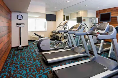 a gym with cardio equipment in a hotel room at Fairfield Inn & Suites Mansfield Ontario in Mansfield