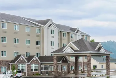 a rendering of the exterior of a hotel at Microtel Inn & Suites by Wyndham New Martinsville in New Martinsville