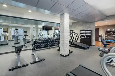 a gym with treadmills and cardio equipment in a building at Courtyard by Marriott Dayton North in Dayton