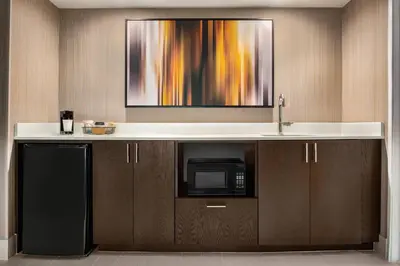 a kitchen with a sink and a microwave at Courtyard by Marriott Dayton North in Dayton