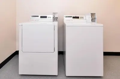 two white refrigerators sitting next to each other at Fairfield Inn and Suites by Marriott Fort Wayne in Fort Wayne