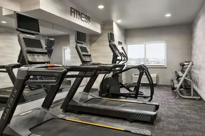 a gym with two treadmills and a treadmill at Fairfield Inn & Suites Findlay in Findlay