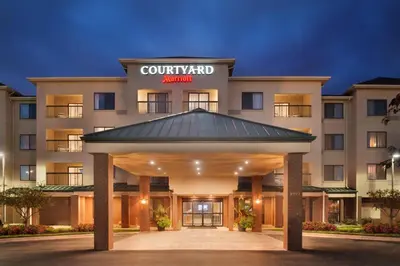 a rendering of the courtyard inn at night at Courtyard by Marriott Dayton Beavercreek in Beavercreek