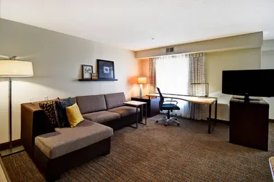a living room with a couch and a desk at Residence Inn by Marriott Dayton Beavercreek in Beavercreek