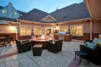 a patio with a fire pit and chairs and tables at Residence Inn by Marriott Dayton Beavercreek in Beavercreek