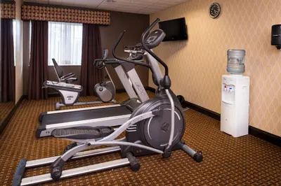 a room with a gym with two exercise bikes at Holiday Inn Express & Suites Bucyrus by IHG in Bucyrus