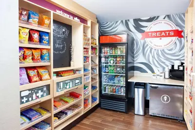 a grocery store aisle with a treats counter and food at Hampton Inn & Suites Niles/Warren, OH in Niles