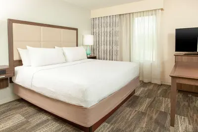 a bedroom with a large bed and a television at Hampton Inn & Suites Niles/Warren, OH in Niles