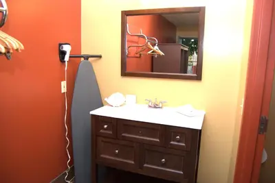 a bathroom with a sink and a mirror at Commodore Resort in Put-in-Bay