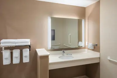 a bathroom with a sink and a mirror at Fairfield Inn & Suites by Marriott Chillicothe in Chillicothe