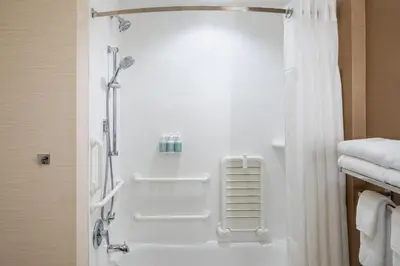 a bathroom with a shower with a shower curtain at Fairfield Inn & Suites by Marriott Chillicothe in Chillicothe