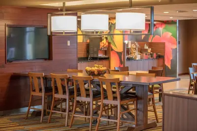 a dining room with a table and chairs at Fairfield Inn & Suites by Marriott Chillicothe in Chillicothe